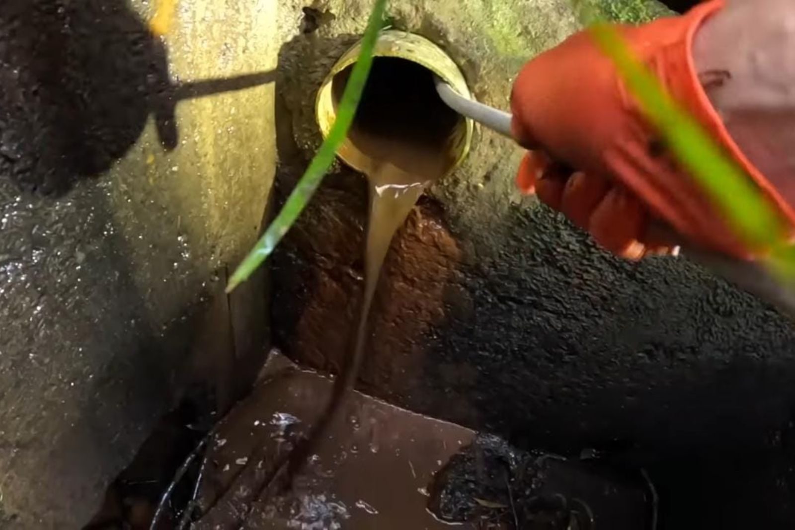 Plumber clearing a clogged drain in a Fort Myers, FL home