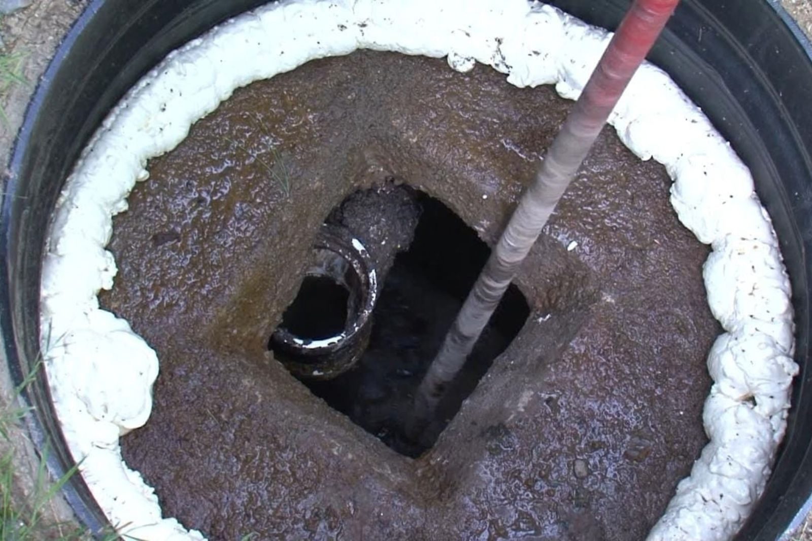 Septic tank pumping service truck at a Fort Myers, FL home